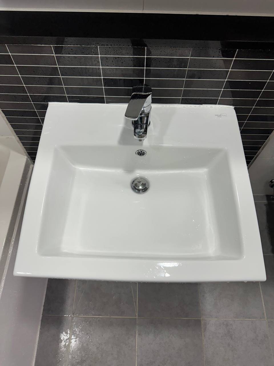 Bathroom sink basin after CLEANX cleaning