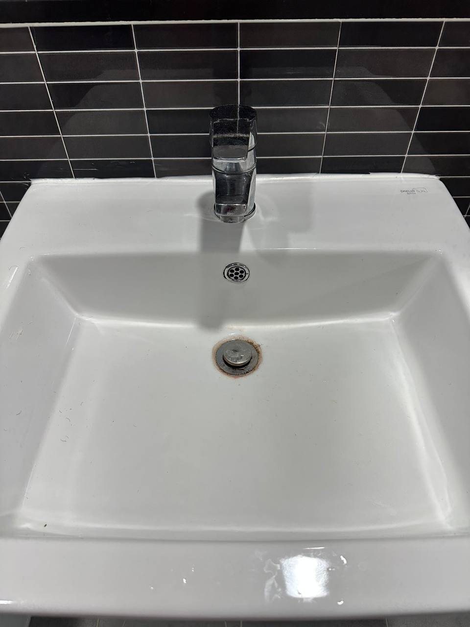 Bathroom sink basin before CLEANX cleaning