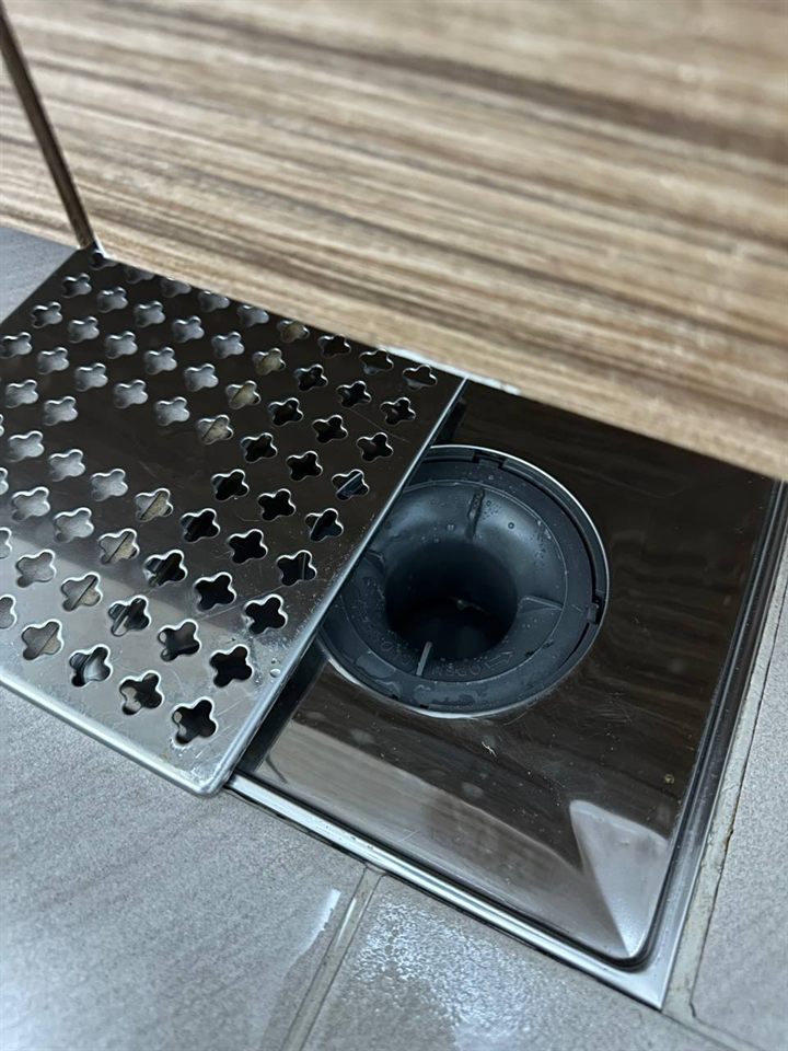 Bathroom floor drain after CLEANX cleaning