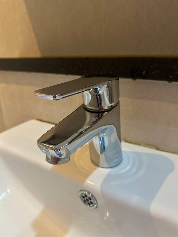 Bathroom sink faucet after CLEANX cleaning